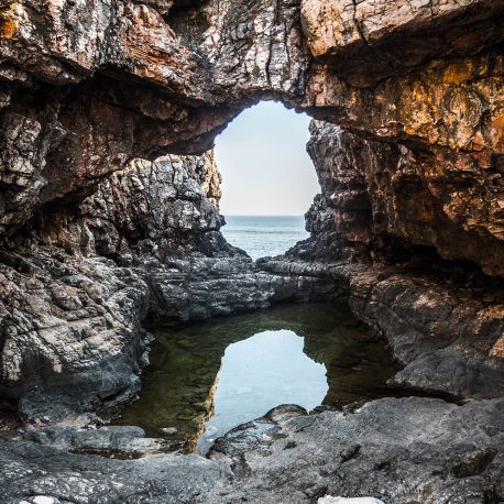 Rock formation framing view of sea