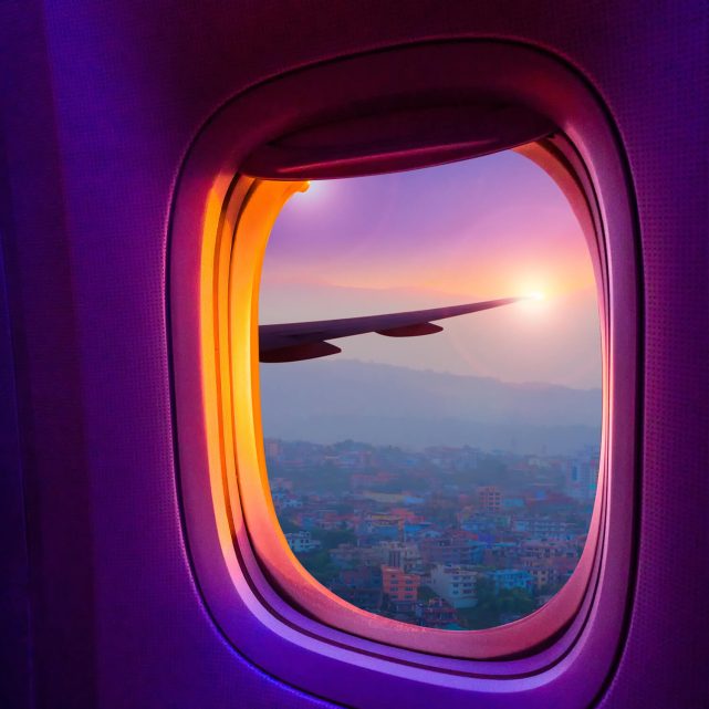View from inside a plane overlooking the wing