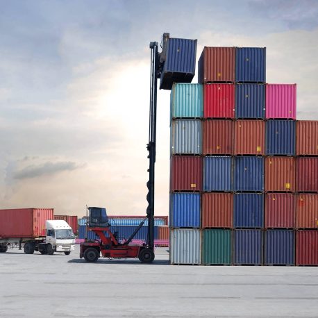 Forklift truck arranging shipping containers